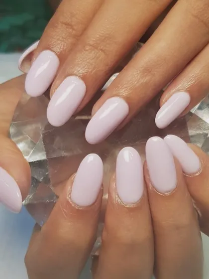This light pink dip powder manicure is stain-free and requires no UV light. It's a healthy and beautiful option for your nails, providing strength and a flawless finish.