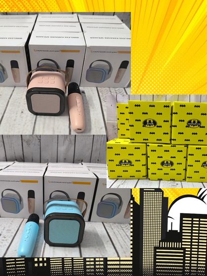 A closer look at the mini Bluetooth karaoke speakers that were included in the Batman hampers, along with the themed boxes used for packaging.