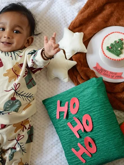 Celebrating your baby's milestones is so important, and I love creating special setups to mark the occasion. This was for a "3/4th year" celebration, combining a festive theme with props that highlight this unique stage in a baby's first year.