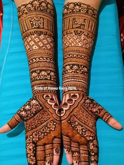 An elegant engagement design featuring symmetrical bands and delicate lotus detailing. This look is traditional yet not overly heavy, setting a graceful tone for the wedding story to come.