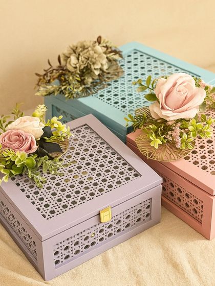 Our Rakhi edit is all about a personalized touch and a feeling of love. This image showcases our beautiful pastel-colored cane-work boxes, ready to be filled with goodies for the special bond between siblings.
