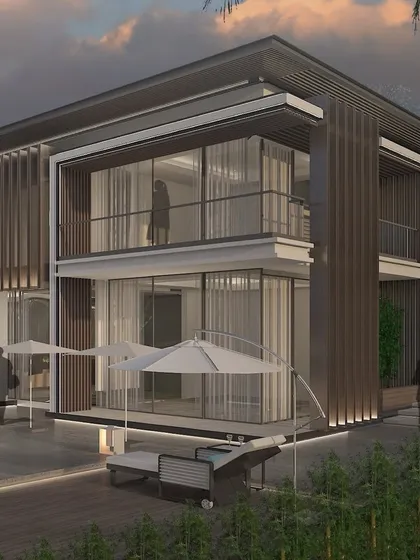 This view showcases the home's strong connection to its outdoor spaces, with large umbrellas and lounge chairs inviting relaxation. The architecture is characterized by vertical louvers and expansive balconies that extend the living areas outwards.