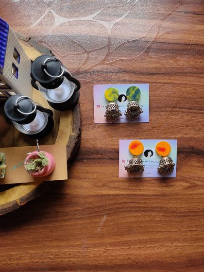 Simple and cute fabric patch studs with jhumki drops. These are available in a variety of hand-painted colors and are a great small accessory for daily traditional wear.