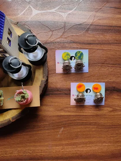 Simple and cute fabric patch studs with jhumki drops. These are available in a variety of hand-painted colors and are a great small accessory for daily traditional wear.