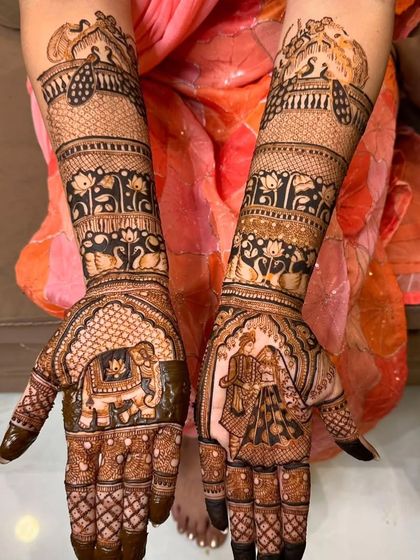 This design balances two central themes. One palm features a majestic elephant inside an ornate arch, while the other shows a classic bride and groom portrait, representing strength and union.