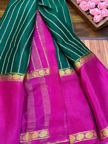 A unique combination of green and pink in a wrinkle crepe Mysore silk saree.