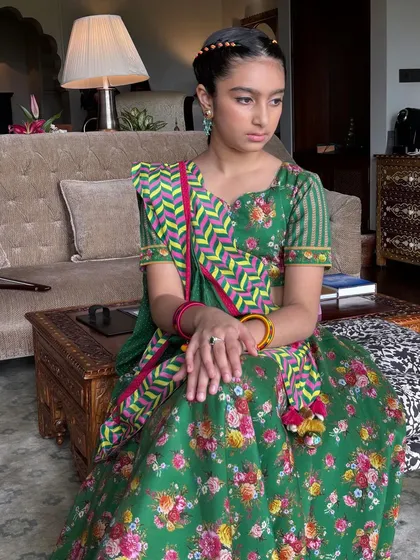 The young client sitting gracefully, her beautiful braided hair neatly styled.