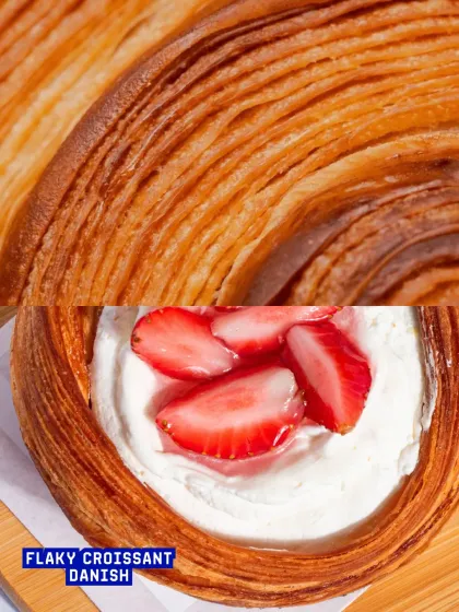A close-up on the incredibly flaky layers of our croissant danish, the perfect base for our creamy fillings.