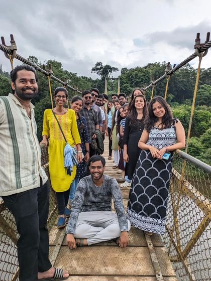 The group having fun on the hanging bridge during the Netravathi trip.