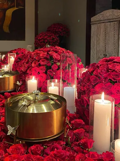 We transform spaces into immersive dining settings. This breathtaking tablescape, set amidst a sea of red roses and candlelight, showcases our commitment to creating a truly romantic and unforgettable atmosphere for your most intimate gatherings.