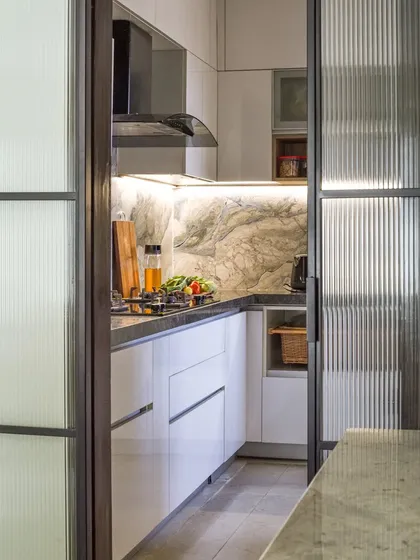 Another view of the fluted glass sliding door, which adds a layer of texture and visual interest to the space.