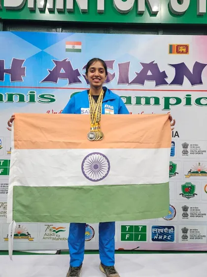 Yashaswini proudly holding the Indian flag.