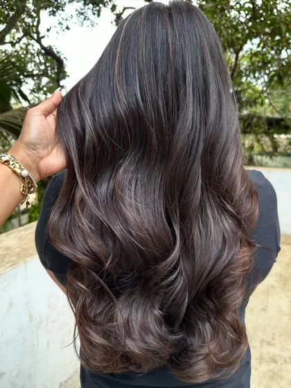 Her first hair color, and we went with a beautiful 'Cocoa Bean' shade. This is a great choice for a first-timer, as it's a subtle, rich brown that enhances natural hair color without being too dramatic.