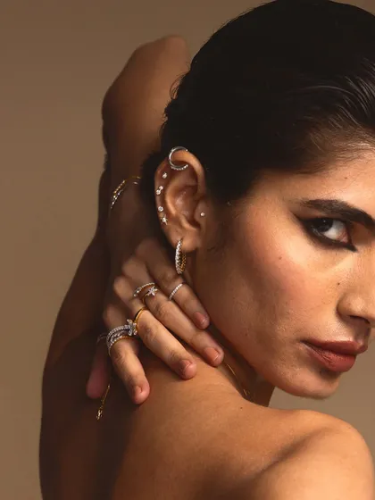 A bolder look for the same Guyal India jewellery campaign. Here, a sharp, graphic winged liner adds a touch of drama to highlight the edgy ear cuffs and rings.