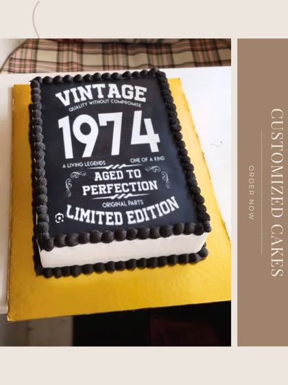 A "Vintage 1974 Aged to Perfection" cake designed to look like a book, perfect for a milestone birthday celebration.