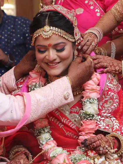 A candid moment of a family blessing the bride. Her makeup is flawless even in these emotional, unposed shots.