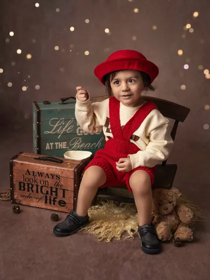 A thoughtful moment from the same little traveler. Capturing a range of expressions, from big smiles to quiet gazes, tells a more complete story of your child.