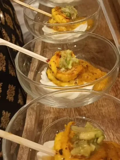 A deconstructed appetizer served in individual glass bowls. This modern presentation style is perfect for intimate gatherings, allowing guests to easily mingle while enjoying sophisticated, flavorful bites.