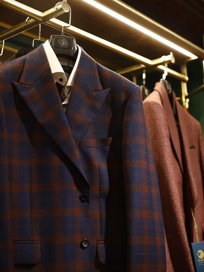 A glimpse inside my Gurugram store, where finished bespoke jackets are on display. You can see the quality and variety of styles I offer, from bold plaids to rich solids.
