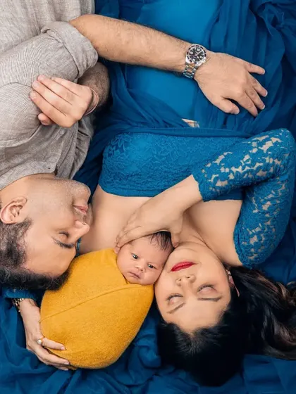 And then, they were three. This is what it's all about. Capturing those first few days with your newborn is pure bliss. This is a precious first family portrait, a memory of when you first held your whole world in your arms.