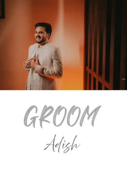 A candid shot of the groom adjusting his sherwani, a small moment of preparation captured with warm, inviting light.