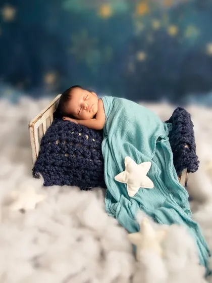 Drifting in a sea of clouds and stars. I love designing these dreamy, serene setups that feel like they are straight out of a fairytale, creating a peaceful and magical portrait of your sleeping baby.