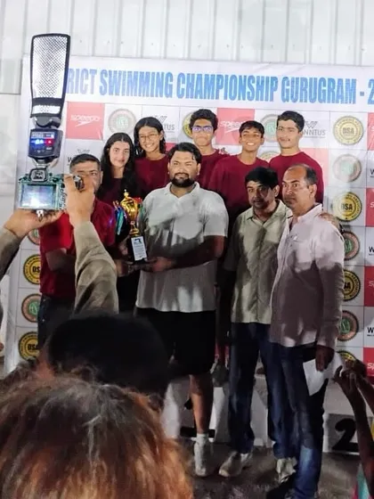 The team celebrating our 2nd Runner Up trophy at the District Swimming Championship Gurugram. With just 7 swimmers, we clinched 40 medals, including 21 golds, and broke a 5-year streak to win the 'Best Swimmer' trophy.