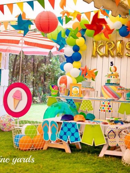 A fun-filled summer pool party theme. The decor included bright colors, beach balls, and a "splish splash" vibe perfect for beating the heat.
