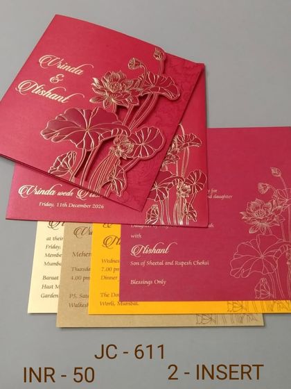 A bold red invitation with a gold embossed lotus design. This card is simple yet striking, perfect for a traditional ceremony, and comes with colorful inserts.