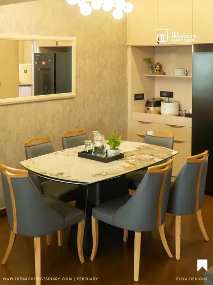 Inspired by Korean minimalism, this living and dining area uses a calm, neutral palette with clean lines and geometric patterns on the wall. The focus is on creating a serene and uncluttered environment with sophisticated lighting.
