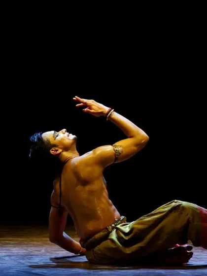 A seated expressive posture from the Pune performance. Not all movements are large; some of the most powerful moments are found in subtlety and control.