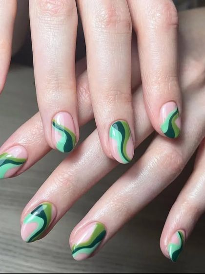 A groovy, retro-inspired design with green and mint swirls on a natural pink base.