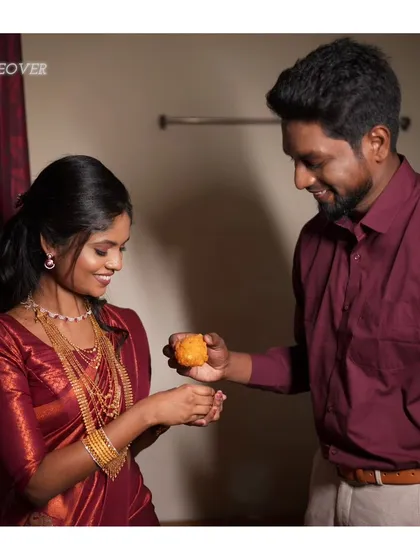 A sweet moment between an engaged couple. The bride's makeup is soft and romantic, perfect for this candid shot.