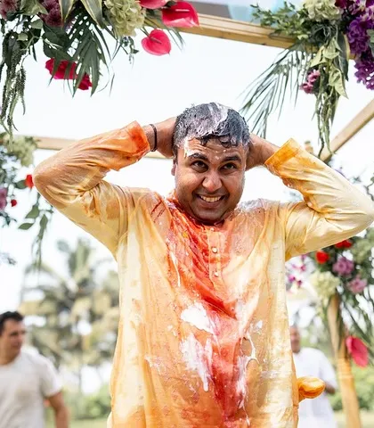 The groom's reaction after being covered in turmeric, curd, and ketchup during his Haldi. A moment of pure, unscripted fun.