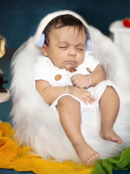 Listening to his favorite tunes while he sleeps. This two-month-old looks so peaceful in this creative, music-themed setup.