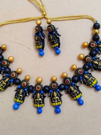 The Mahalakshmi necklace with royal blue beads, providing a rich and vibrant option.