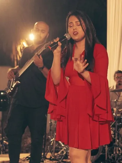 Singing with the full band behind me. For weddings, we can provide a complete ensemble to create a rich, layered sound for your sangeet or reception.