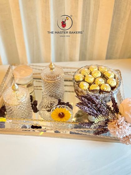 Make your dry fruit gifting more traditional and beautiful. This hamper uses a mirrored tray and decorative crystal jars to present premium dry fruits and chocolates in a truly special way.