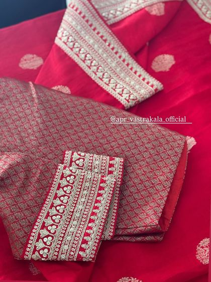 A close-up of the red brocade blouse.