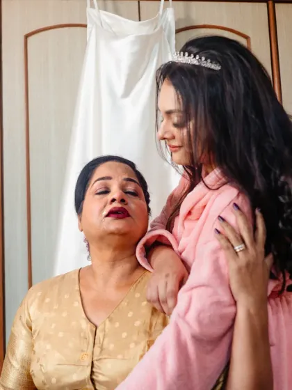 A tender moment between a bride and her mother before the ceremony begins. These quiet, emotional connections are the heart and soul of a wedding day.