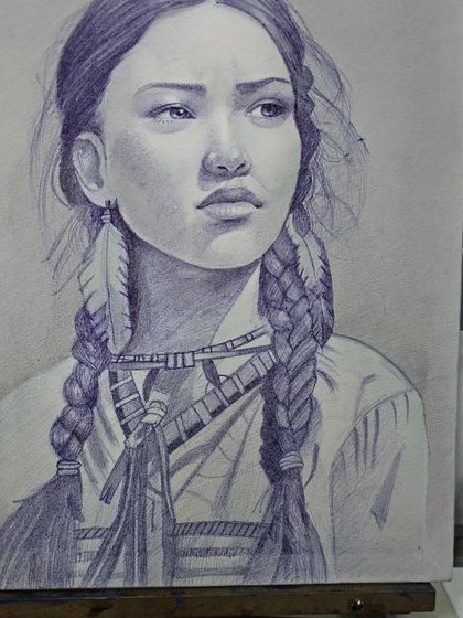 The nearly complete ballpoint pen portrait on the easel, showcasing the rich tones and textures achieved with simple cross-hatching.