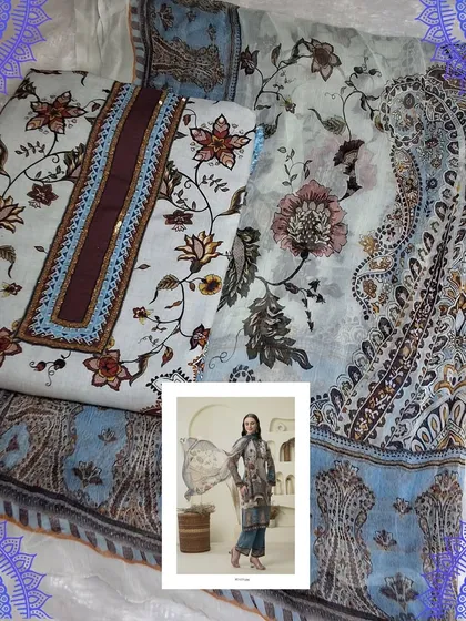 A classic black and blue dress material with a beautiful digital print. The intricate patterns give it a very rich and sophisticated look, perfect for an evening event.