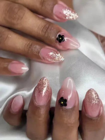 A beautiful set featuring a falling glitter effect and delicate black 3D flowers. This was a custom design for a client who wanted something unique.