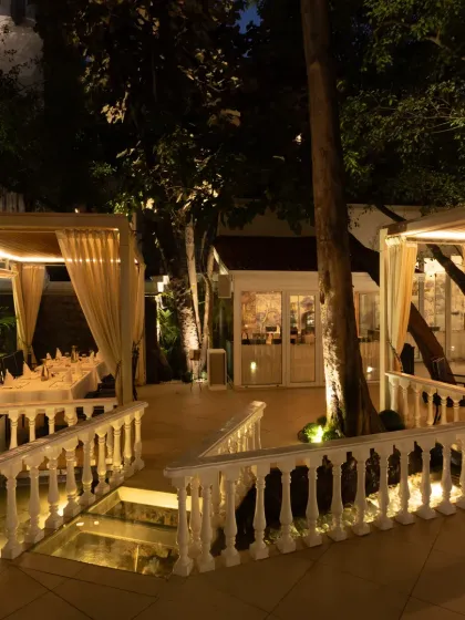 As evening arrives, the terrace comes alive. This is the view of our outdoor private celebration venue, where the lights and greenery create an atmosphere that feels like a Spanish courtyard.