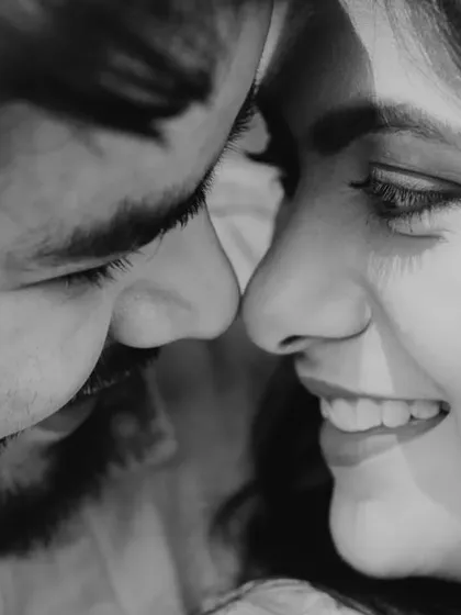 A duplicate of image 34, an extreme close-up in black and white, focusing on the intimate space between the couple.