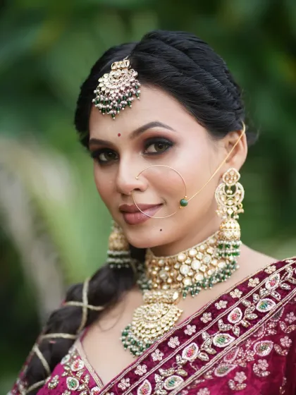 A classic bridal portrait, with the bride looking directly at the camera, exuding confidence.