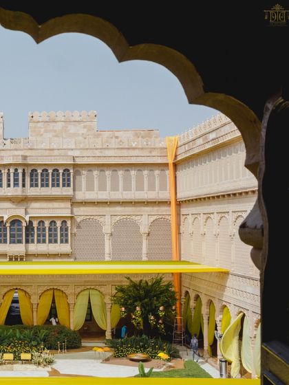 The entire palace courtyard at Suryagarh was turned into a sunshine party for this Haldi. We used brilliant yellow drapes against the sandstone architecture to create a stunning contrast that was both royal and vibrantly cheerful.