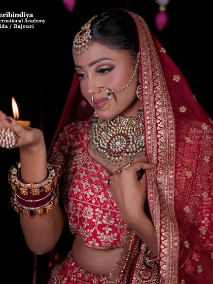 A festive bridal look perfect for Diwali. The warm glow of the diya enhances the radiant makeup, a look you can create for festive season clients.