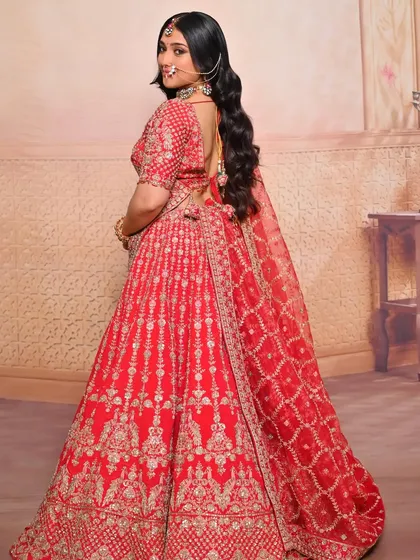 A back view showing the elegant hairstyle and dupatta draping, essential skills for any professional bridal artist.