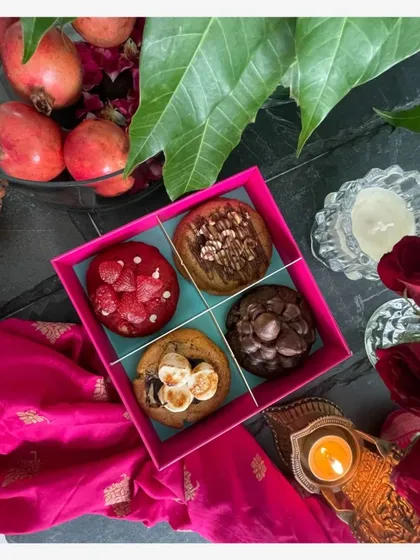 My Gourmet Cookie Box is a festival of flavors. This one includes four of my favorite creations: Red Velvet with white chocolate, Double Chocolate Ganache, a classic S'mores Chocolate Chip, and a nutty Hazelnut Chocolate cookie. It is a perfect gift for sharing with family and friends.